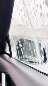  Looking out a car window at a car wash