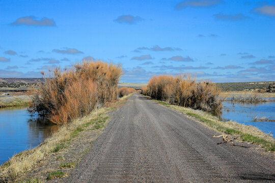 Gravel Road Through A Wetland In Eastern Oregon