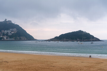 Fototapeta premium Scenic view of La Concha beach, Santa Clara Island and Monte Igueldo in San Sebastian, Basque Country, Spain.