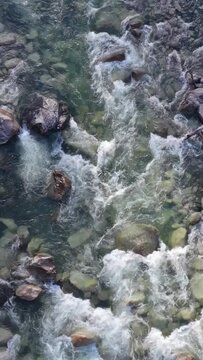 Rushing Mountain River Flowing Through Rocky Landscape in British Columbia, Canada