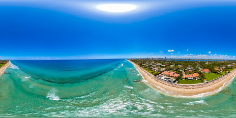 Obraz premium Palm Beach Florida luxury beach front real estate. Aerial 360 VR drone photo 2026 erosion with climate change