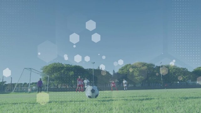 Soccer kicker running up striking ball arcing over wall aiming goal GK readying hex overlay moving