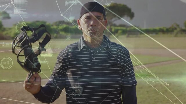 Vertical video: Raising arm, man in striped polo removing headgear, revealing face on field, HUD
