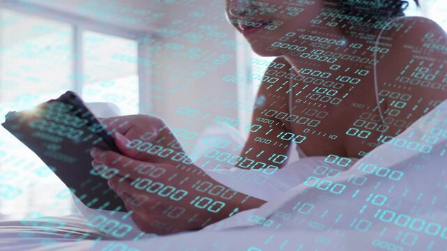 Female adult sitting by window tapping tablet, binary overlay animating while checking tech content