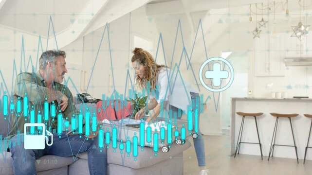 Man tapping tablet and woman packing suitcase graphs and icons appearing showing travel costs