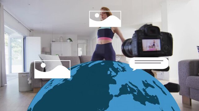 DSLR starting recording, fitness coach stretching, holding prayer pose, globe covering lower frame