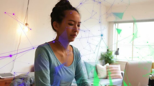 Woman opening eyes, typing on laptop and sipping mug for remote work, animated polygons overlapping