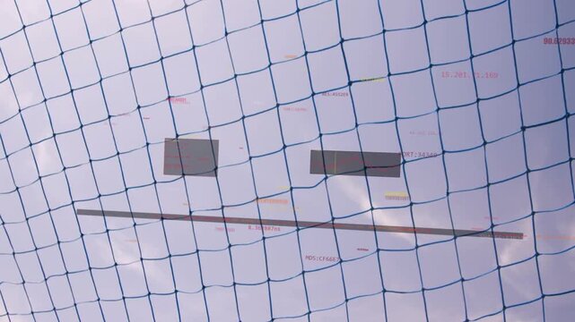 Soccer ball entering from right, bending blue mesh net over crossbar, showing tracking boxes