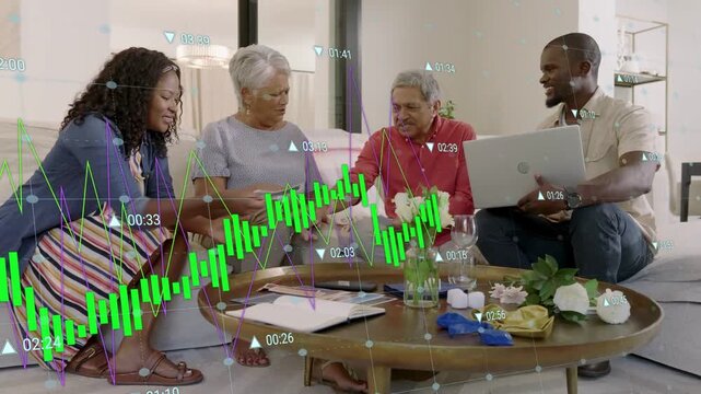 Adult man showing laptop screen starting finance chat, group sorting cards, green graph over table