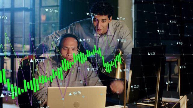Senior typing laptop, junior pointing monitor as green charts shifting, driving finance consensus