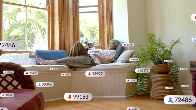 Mature woman reclining on window bench turning pages, animated UI badges multiplying for marketing