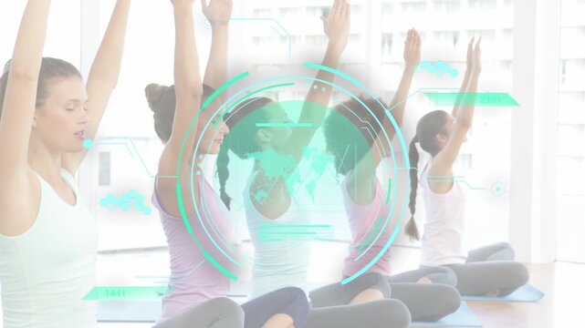 World-map HUD appearing over group, women on blue mats breathing and raising arms in fitness class