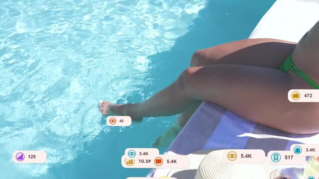 Woman sitting poolside relaxing, dipping toes and creating ripples, causing marketing data bubbles