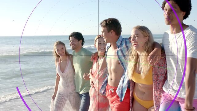 Group of six friends following right man's point walking along beach, purple HUD tracking marketing