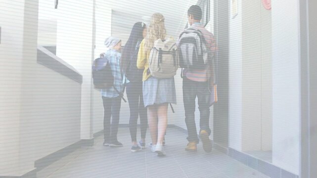Four students walking down hall during school class change, backpacks on, animated arrow guiding