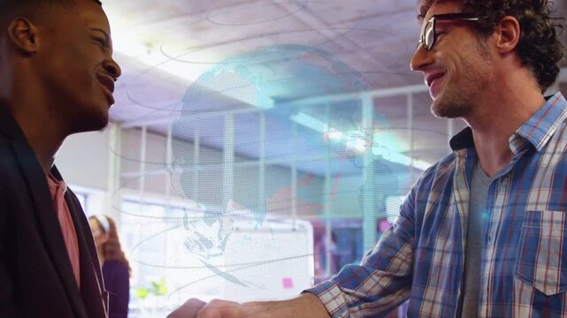 Men shaking hands in office, initiating camera pullback and globe overlay sealing business deal