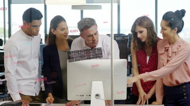 Business team gathering, woman pointing at screen, others tapping phone, studying data on glass