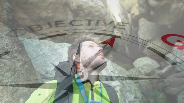 Hiker pausing, lifting head in outdoor canyon assessing route, showing compass pointing toward GOAL
