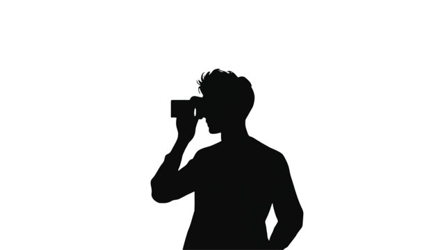Photographer silhouette captures a visual moment while looking through a digital camera lens against a clean white background.