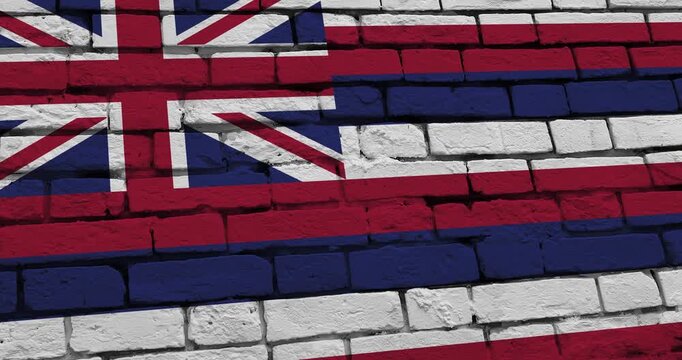 A panning video of a brick wall with the hawaii state flag of the United States of America