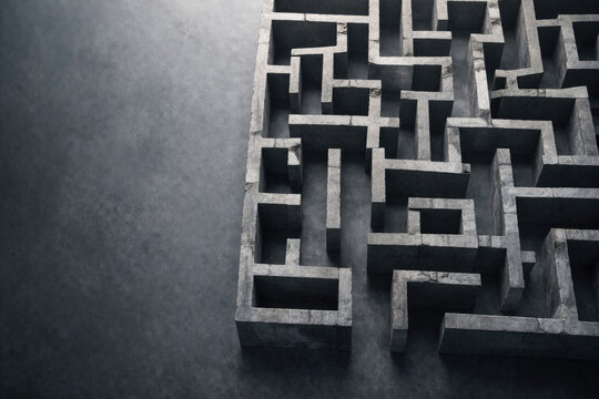 A stone labyrinth on a dark surface. Space for text.