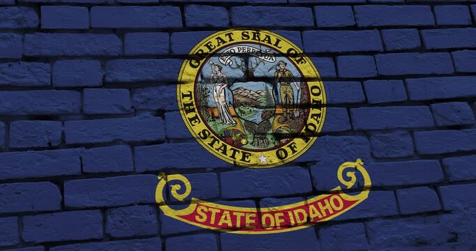 A panning video of a brick wall with the idaho state flag of the United States of America