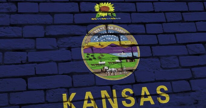 A panning video of a brick wall with the kansas state flag of the United States of America