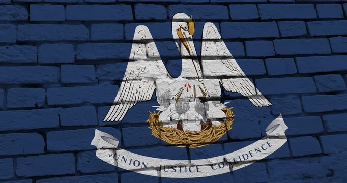 A panning video of a brick wall with the louisiana state flag of the United States of America