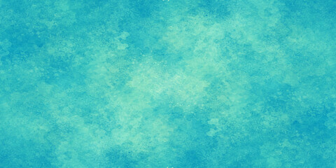 Obraz premium Abstract blue grunge background featuring a vintage textured paper design with aged paint and a rough turquoise surface pattern for an artistic wallpaper backdrop