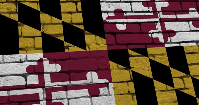 A panning video of a brick wall with the maryland state flag of the United States of America