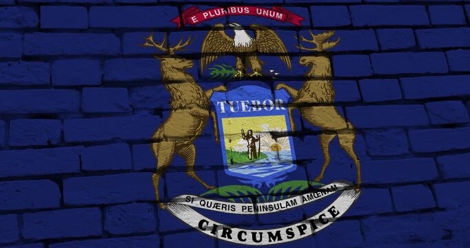 A panning video of a brick wall with the michigan state flag of the United States of America
