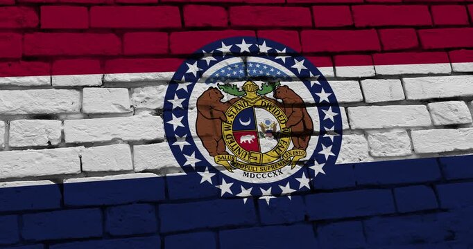 A panning video of a brick wall with the Missouri state flag of the United States of America