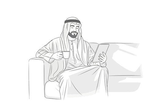 Arab man sitting on a sofa and using a digital tablet