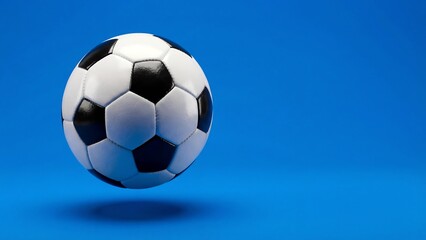 Fototapeta premium Floating soccer ball isolated on clean blue background with soft shadow, minimal sports product mockup for branding, advertising, poster design, web banner and promotion art setsAI