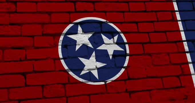 A panning video of a brick wall with the Tennessee state flag of the United States of America