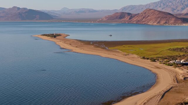 Watch a sunrise over Bahia De Los Angeles in Baja California, Mexico. Enjoy the views of the beach and landscape at dawn.