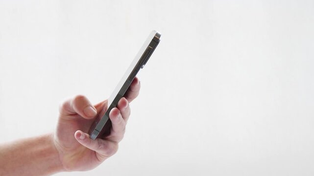 Close up of hand typing on smartphone touchscreen with sound
