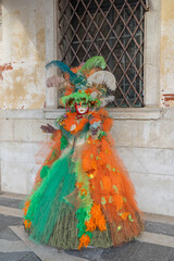 Naklejka premium Venice Carnival masks and costumes in Venice Italy. Colourful masquerade festival with ornate designs creates iconic cultural celebration.