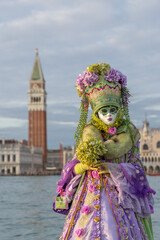 Obraz premium Venice Carnival masks and costumes in Venice Italy. Colourful masquerade festival with ornate designs creates iconic cultural celebration.