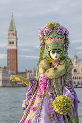 Obraz premium Venice Carnival masks and costumes in Venice Italy. Colourful masquerade festival with ornate designs creates iconic cultural celebration.