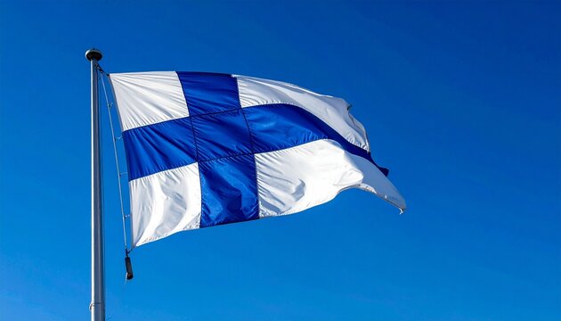 Finland national flag with blue Nordic cross on white field, flying against clear sky, symbolizing heritage, culture, purity, and national identity.