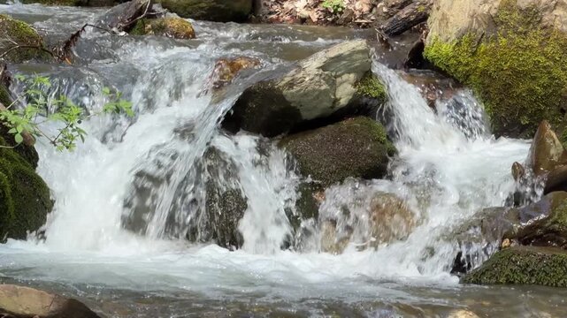 View of the fast flowing water of streams in the Balkan Mountains in Central Bulgaria in the spring