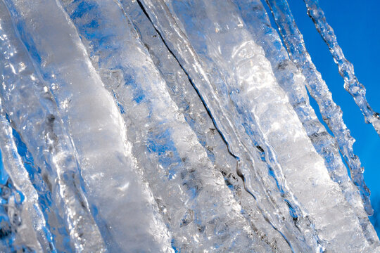 Large icicles against a blue sky