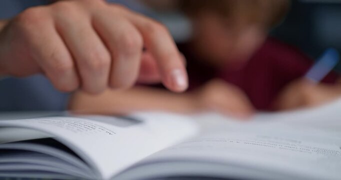 Parent Provides Detailed Guidance To Son On Executing Precise Pencil Movements For Writing Practice