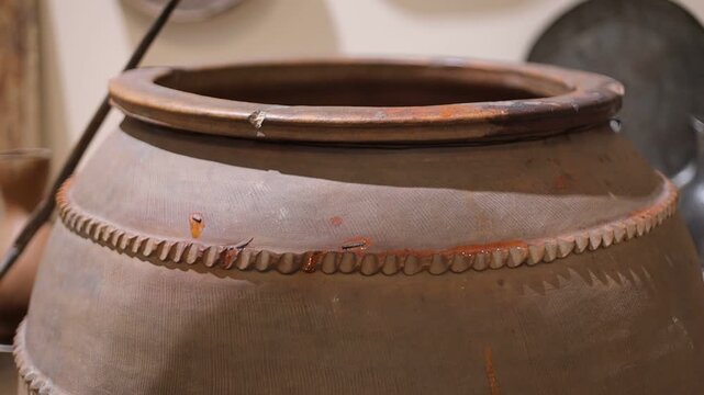 A close-up shot of a pot with a spoon inside, perfect for use in cooking or food-related scenes