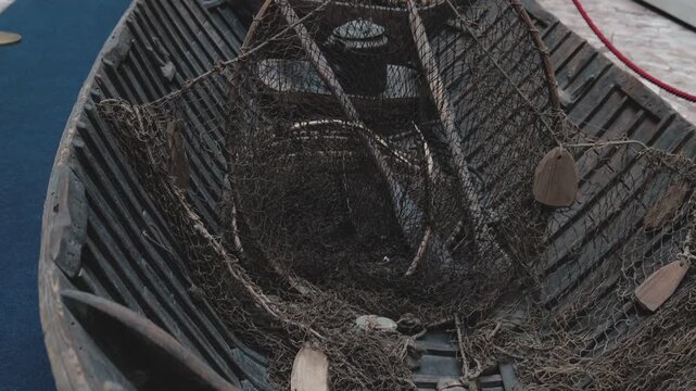A boat with fishing nets, suitable for outdoor activities or marine-themed illustrations