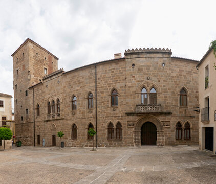 Gothic Facade of the Palace of Monroy with Medieval Stone Arch and Balcony in Plasencia, Spain