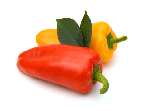 Lovely mini peppers on white background 