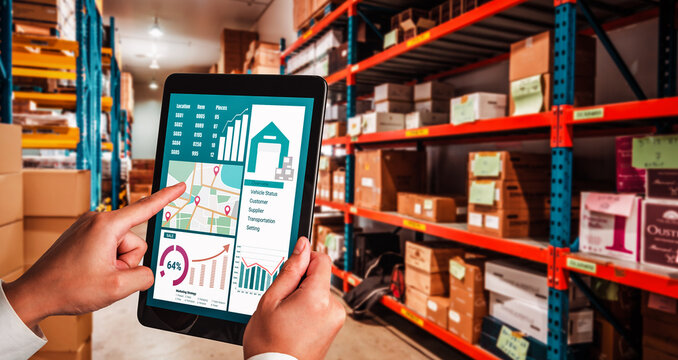 Warehouse management innovative software in computer for real time monitoring of goods package delivery . Computer screen showing smart inventory dashboard for storage and supply chain distribution .