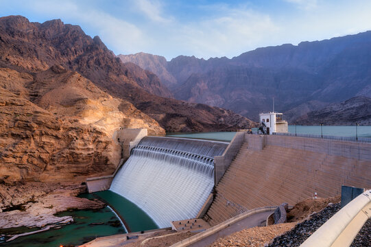 Wadi Dayqah Dam with mountain landscape in Oman at golden hour. Muscat, Oman